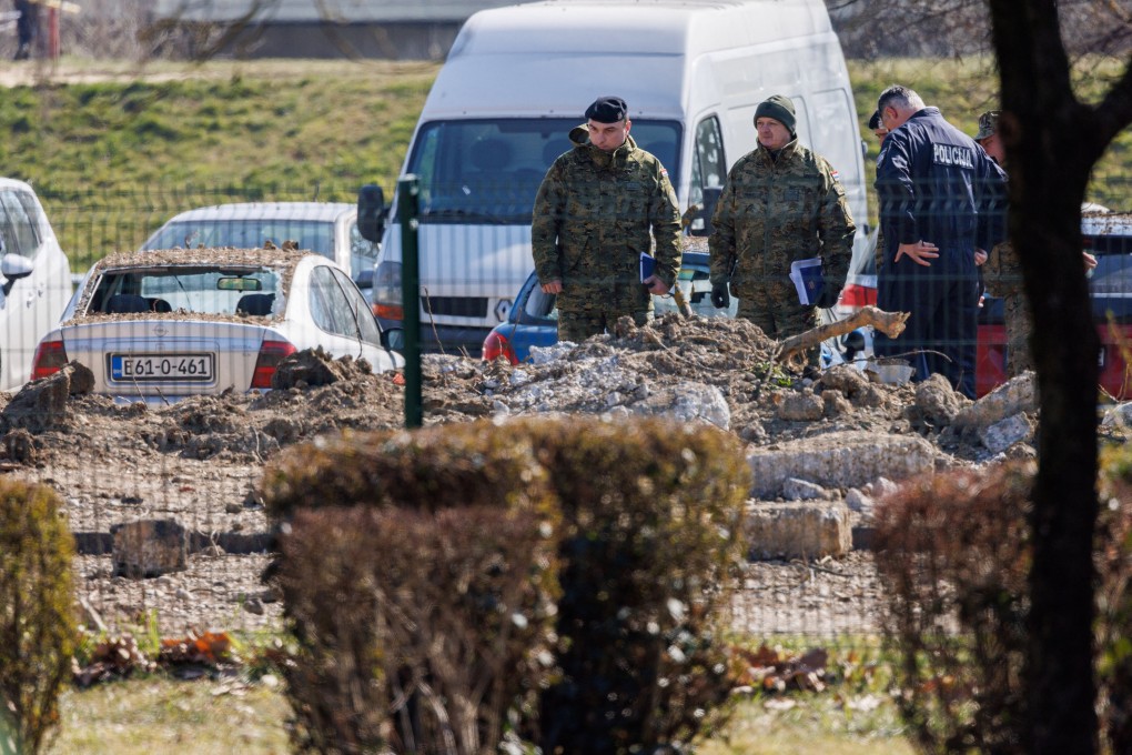 Police and soldiers stand at a drone crash site, following Russia’s invasion of Ukraine, in Zagreb, Croatia on March 11. Photo: Reuters
