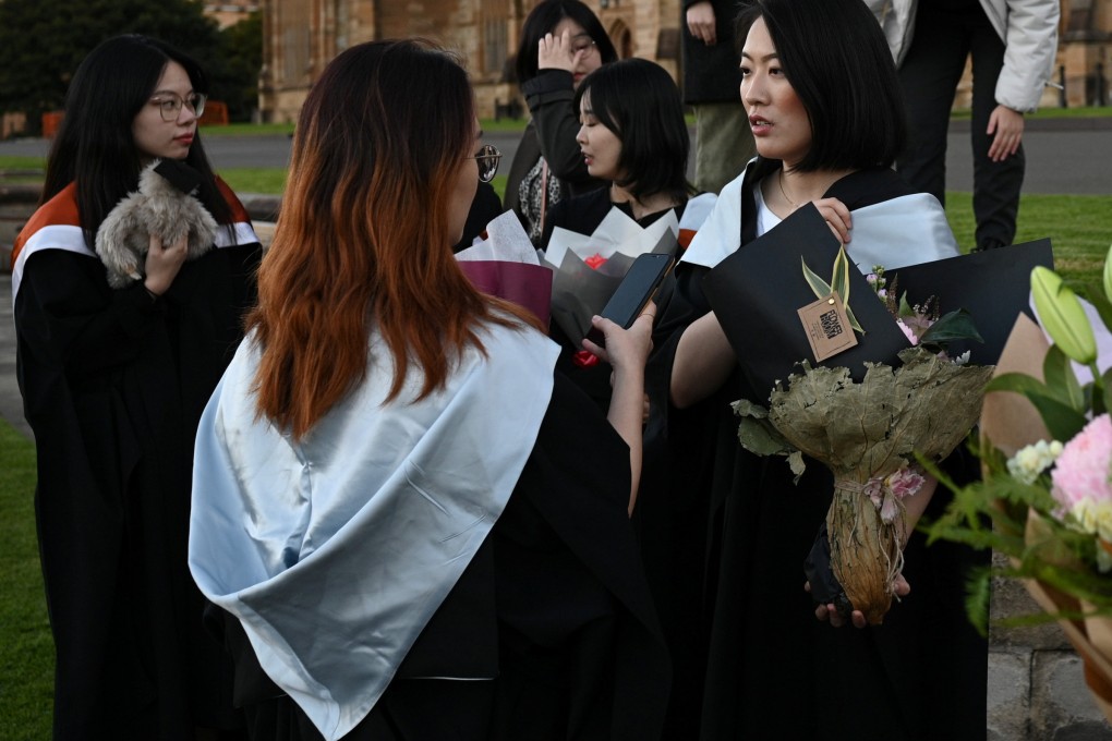 International students from China get ready to take pictures in their graduation gowns on the University of Sydney campus, after their in-person graduation ceremony was cancelled during the coronavirus outbreak, in Sydney, Australia, on July 4, 2020. Photo: Reuters