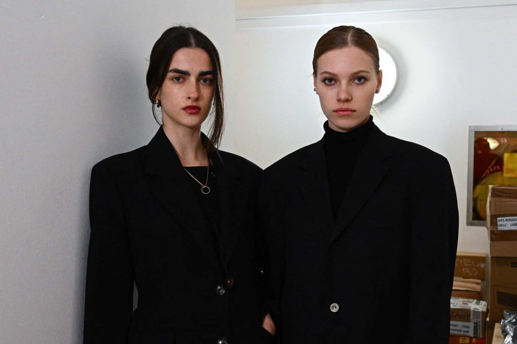 Ukrainian models Bogdana Didenko Nevodnik (left) and Valya Fedotova at the Ukrainian consulate in Milan, where they help pack supplies to be sent to war-torn Ukraine. Photo: AFP
