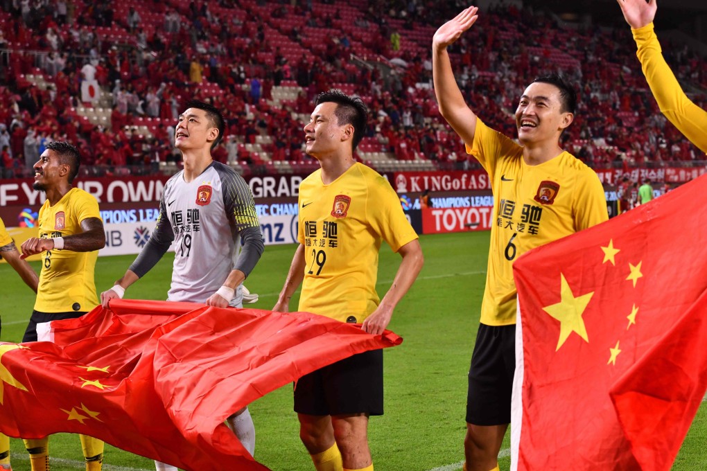Former national team captain Feng Xiaoting (right) says the commentary surrounding Chinese football is unhelpful. Photo: AFP