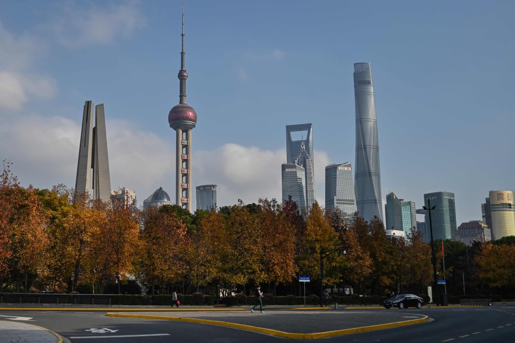 Street scene in Shanghai’s Lujiazui financial centre on December 16, 2019. Shanghai Tower, China’s tallest skyscraper, towers over its surroundings on the right. Photo: AFP