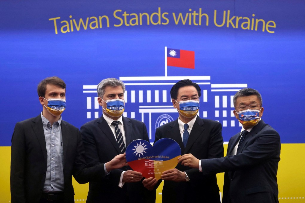 Taiwanese Foreign Minister Joseph Wu and Cyryl Kozaczewski, director of the Polish office in Taipei, launch humanitarian aid for Ukraine. Photo: Reuters