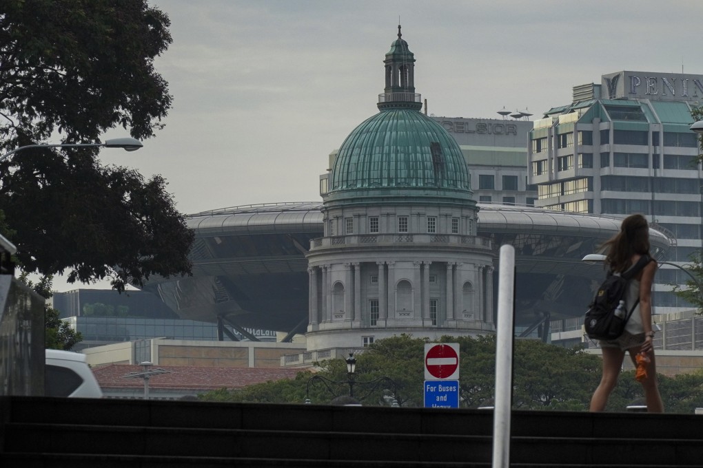 The Supreme Court of the Republic of Singapore shown in the background. The Supreme Court consists of the Court of Appeal and the High Court and hears both civil and criminal matters. Roy Issa
