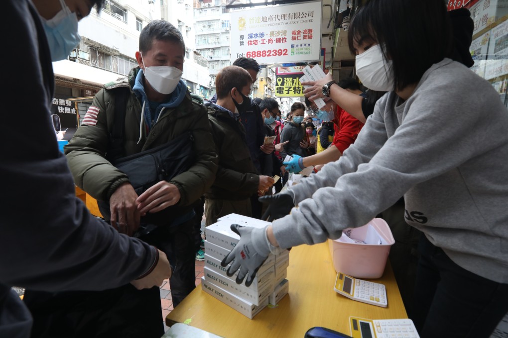 Residents snap up rapid Covid-19 tests at a shop in Sham Shui Po late last month. Photo: Yik Yeung-man