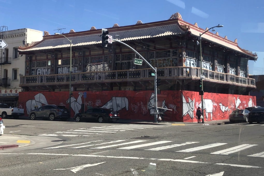 A mural of Chinese Zodiac signs are painted onto the wood used to board up a historic building in Oakland’s Chinatown. Photo: Ralph Jennings