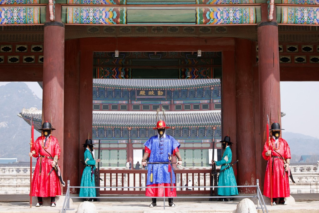 The Royal Guards at Gyeongbok Palace in Seoul, South Korea, wear masks to prevent the spread of Covid-19. Photo: Reuters