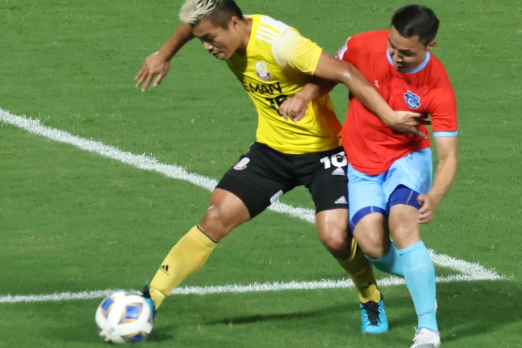 Ngan Lok-fung (yellow) of Lee Man attempts to get away from Athletic 220’s Enkhbileg Purevdorj in last year’s AFC Cup group match at Tseung Kwan O Sports Ground. Photo: K. Y. Cheng
