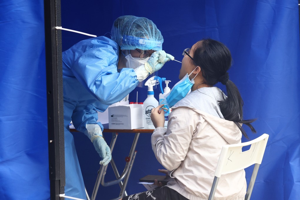 Residents of Lee Yat House, Shun Lee Estate, undergo mandatory testing while under lockdown amid Hong Kong’s fifth wave of the coronavirus pandemic on March 14. Photo: SCMP / Dickson Lee
