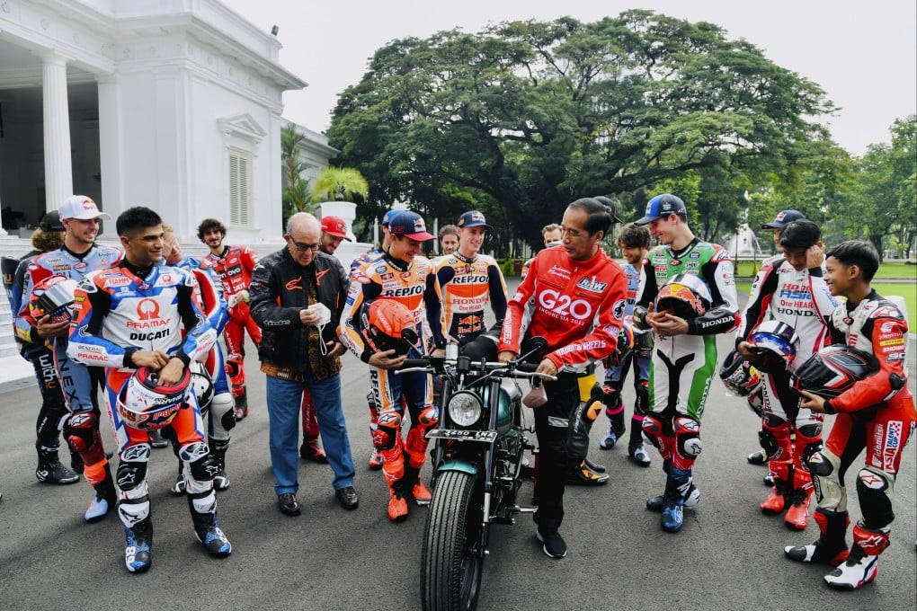 Indonesia’s President Joko Widodo (C) and his motorbike during a meeting with MotoGP riders in Jakarta on Wednesday. The
nation hosts a MotoGP race at the new Mandalika circuit on the island of Lombok 18-20 March. Photo: EPA-EFE