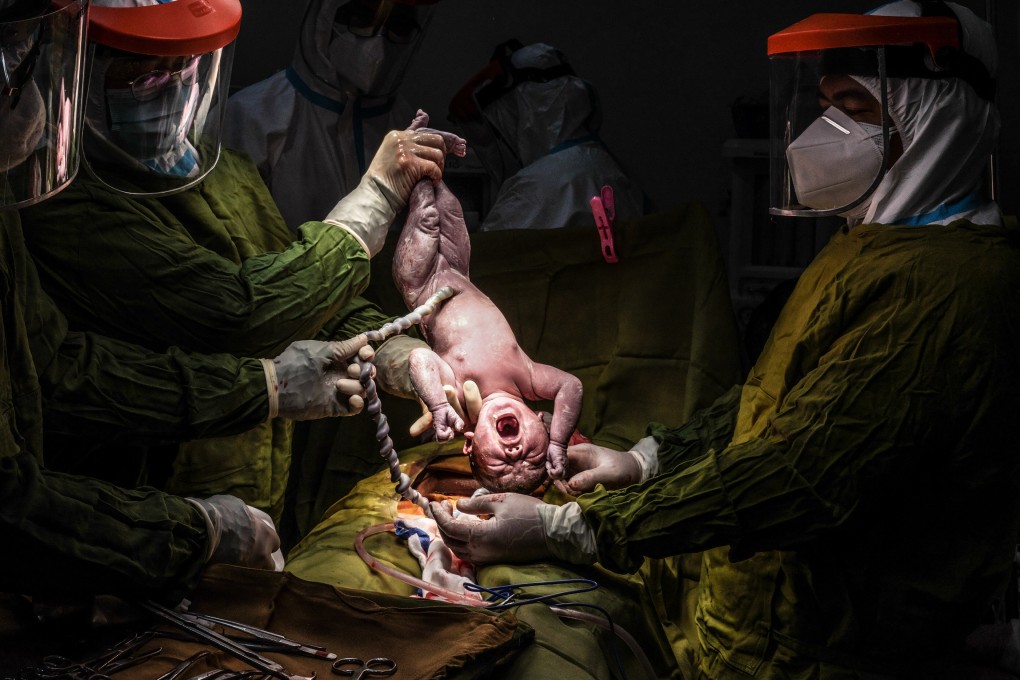 Dr. Agnes C. Lubong-Bernabe and her team deliver a baby at Nueva Vizcaya Provincial Hospital, in Bambang, in the Philippines. Photo: Xyza Cruz Bacani / Christine Park Gallery