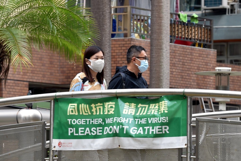 People wearing masks walk on a path in Hong Kong on Thursday. Photo: Xinhua