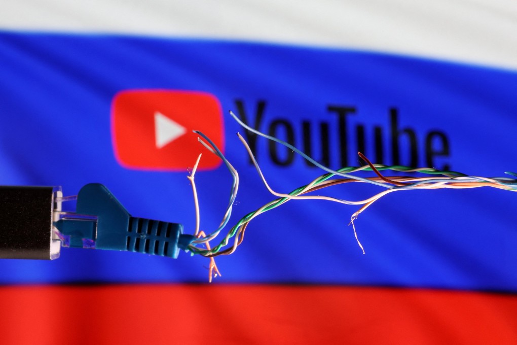 A broken Ethernet cable is seen in front of Russian flag and YouTube logo in this illustration taken March 11, 2022. Photo: Reuters