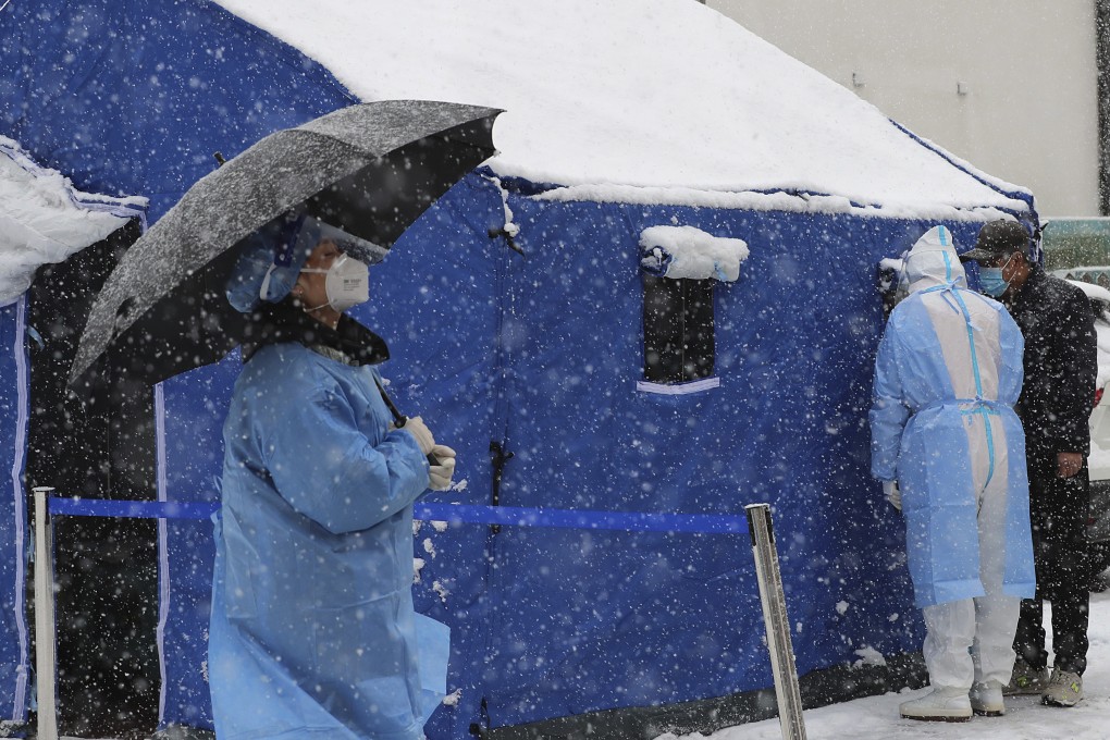 In Changchun in Jilin province, a tent is set up to collect swab samples for Covid-19 tests. Officials in China are under pressure to control outbreaks or face punishment. Photo: Chinatopix via AP
