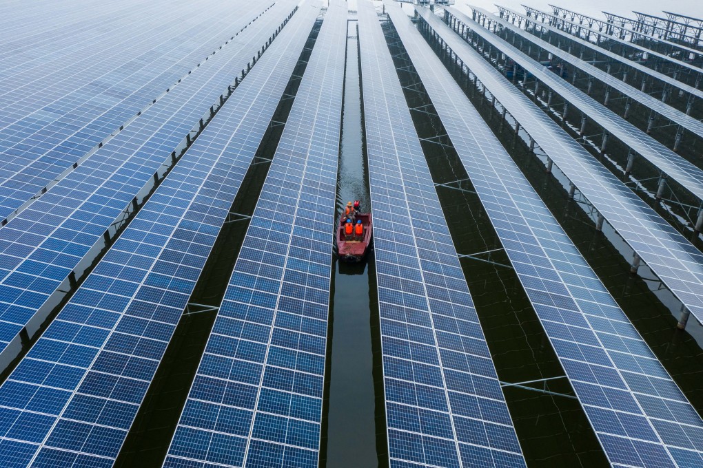 Staff members inspecting a 550 megawatts photovoltaic power station in Wenzhou in eastern Zhejiang province in December 2021. Photo: Xinhua