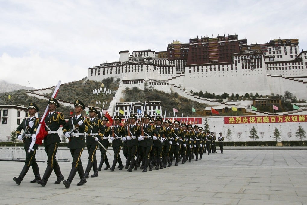 Paramilitary police hold a ceremony to mark the anniversary of the crushing of the 1959 Tibetan uprising and the Dalai Lama’s flight into exile. Photo: AP