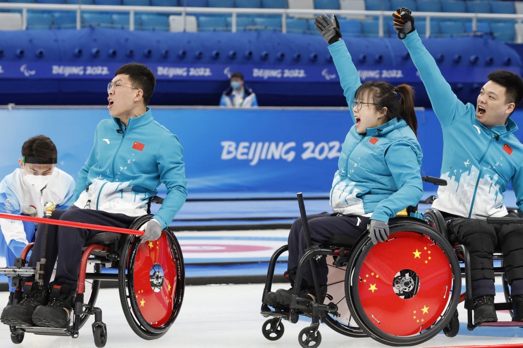 China’s wheelchair curling team cheers at the Beijing 2022 Winter Paralympic Games on March 12. Photo: Reuters