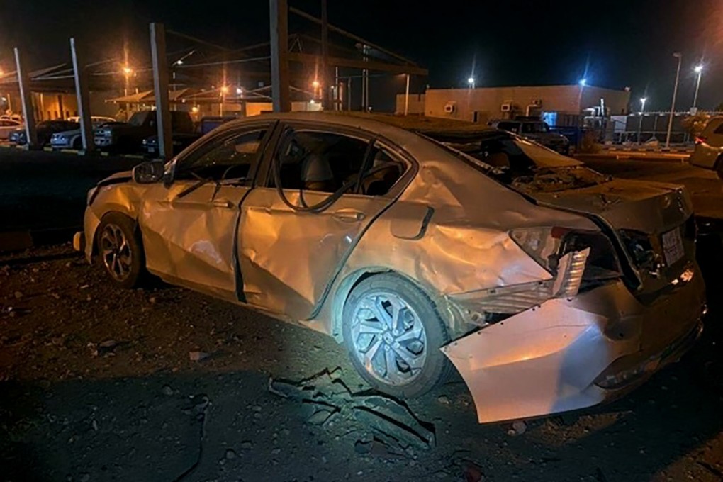 A damaged car is parked at an Aramco terminal in the southern border town of Jizan, Saudi Arabia on March 20 after Yemen’s Houthi rebels unleashed a barrage of drone and missile strikes. Photo: Saudi Press Agency via AP