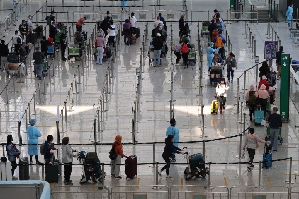Inbound travellers arriving at Hong Kong International Airport queuing up to be transported to quarantine hotels in the city. Photo: May Tse