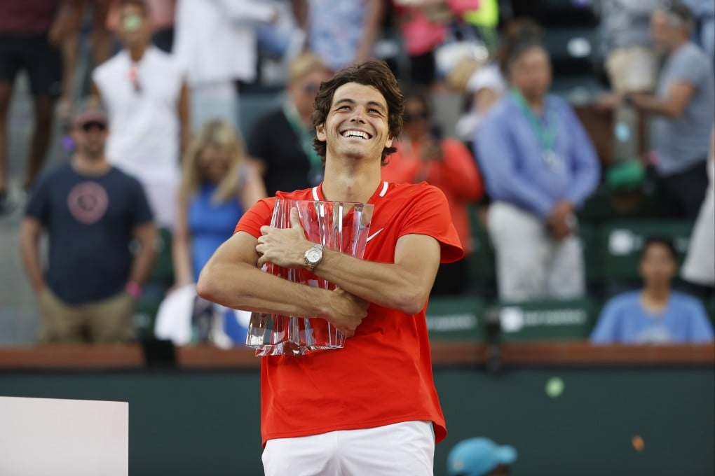 Taylor Fritz celebrates with the championship trophy after beating Rafael Nadal in the men’s final of the BNP Paribas Open at Indian Wells. Photo: EPA-EFE