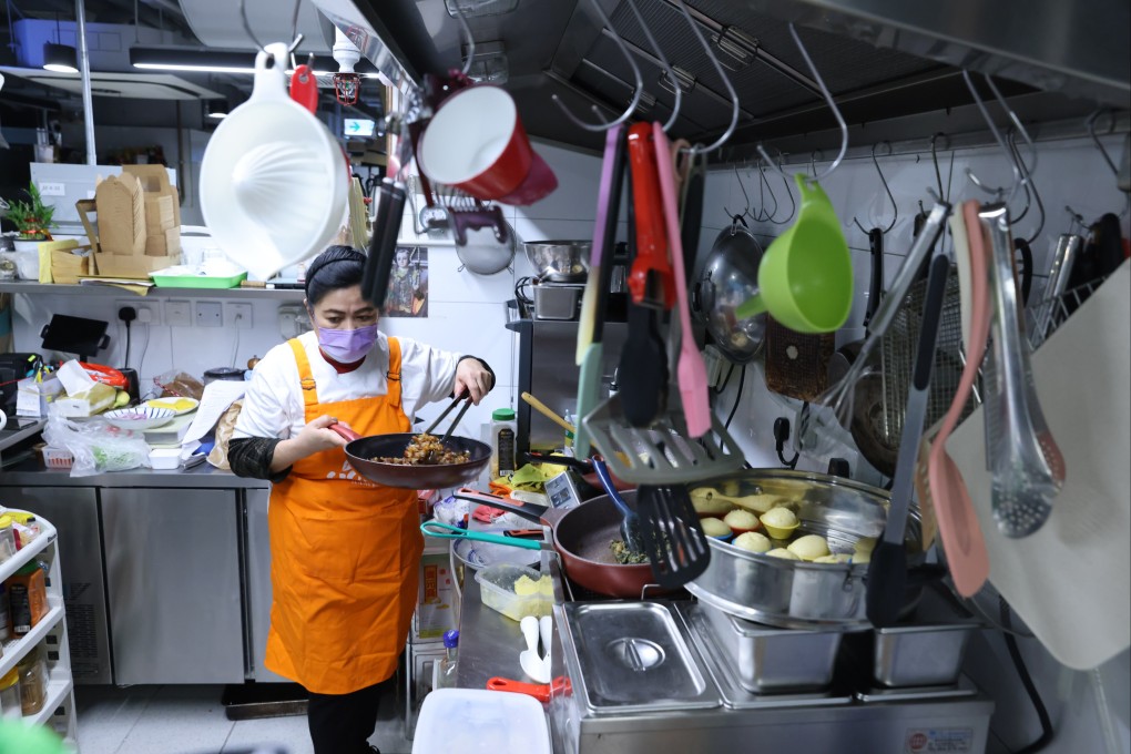 Siony Yumul of Siony’s Lutong Bahay works in a cloud kitchen in Sai Ying Pun, Hong Kong. The shared spaces provide cooking spaces for rent, and some offer marketing, market research and delivery services. Photo: Nora Tam