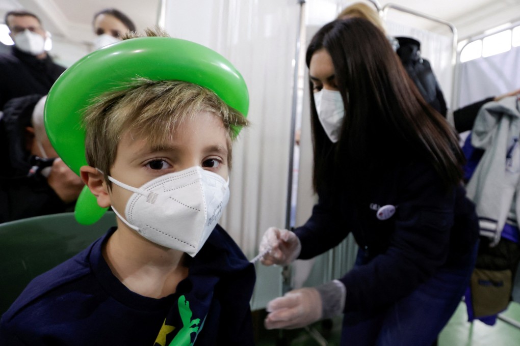A child receives a vaccination against Covid-19 at a school in Naples, Italy, in January. Photo: Reuters