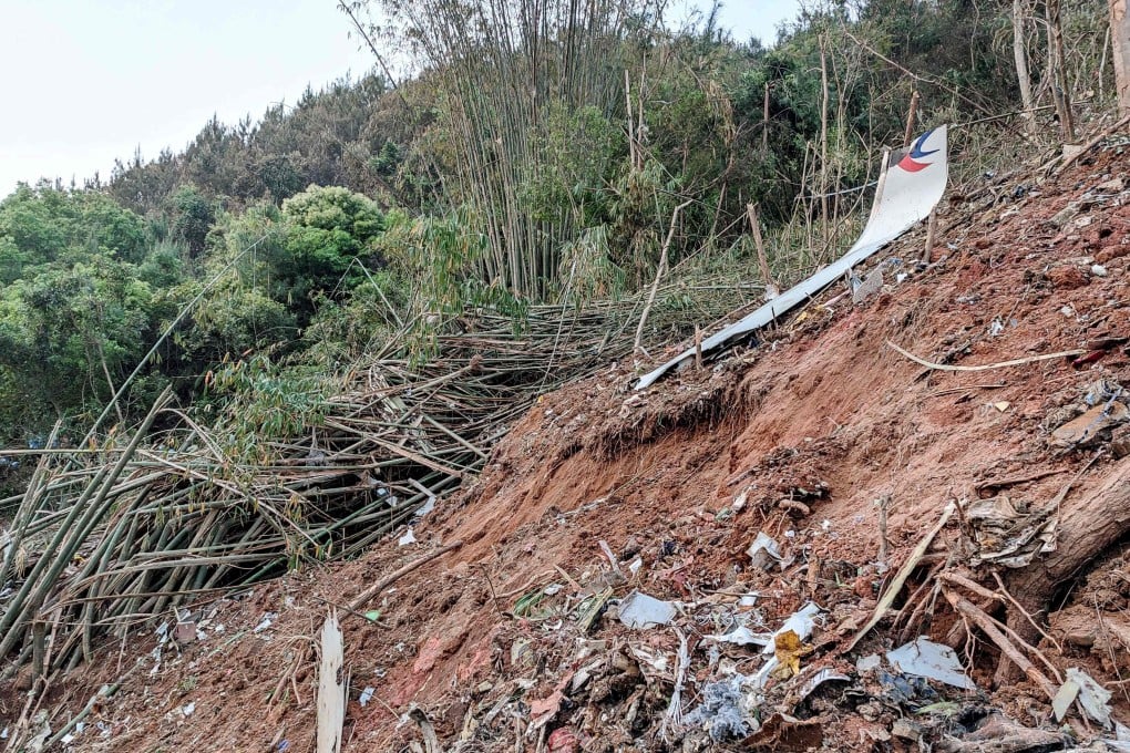Wreckage from the plane after it crashed into a hillside in southern China. Photo: CNS / AFP