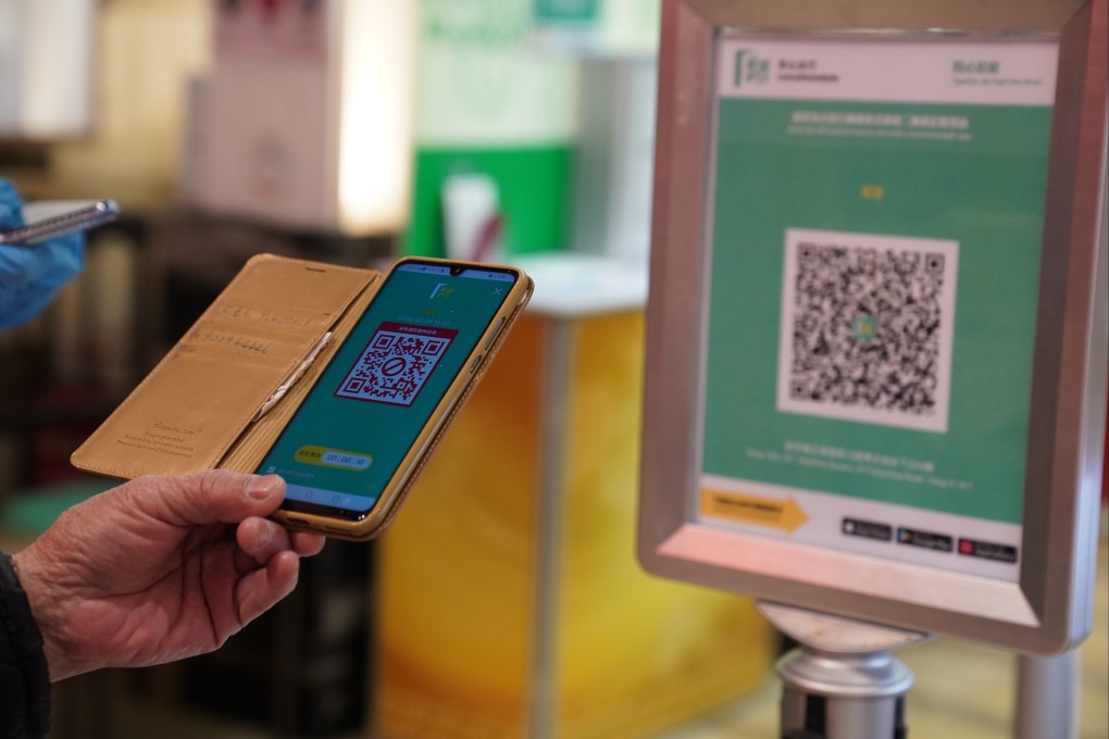 A man uses the Leave Home Safe mobile app to enter a restaurant in Maritime Square in Tsing Yi in February. Photo: Sam Tsang