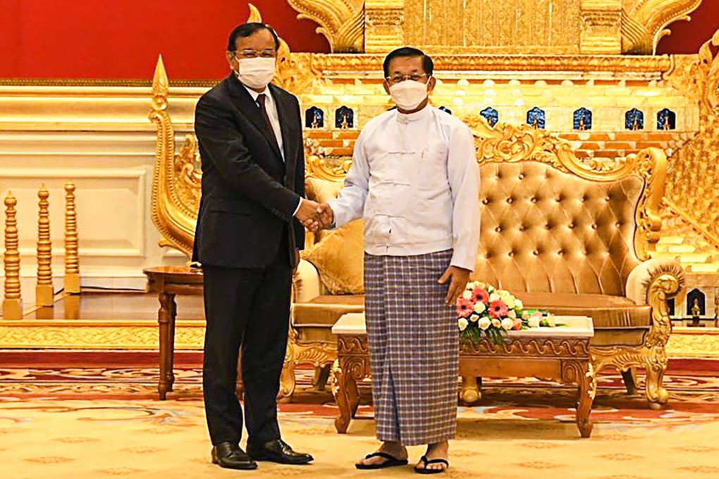 Asean special envoy Prak Sokhonn (left) shakes hands with Myanmar’s armed forces chief Senior General Min Aung Hlaing. Photo: Myanmar Military Information Team / AFP