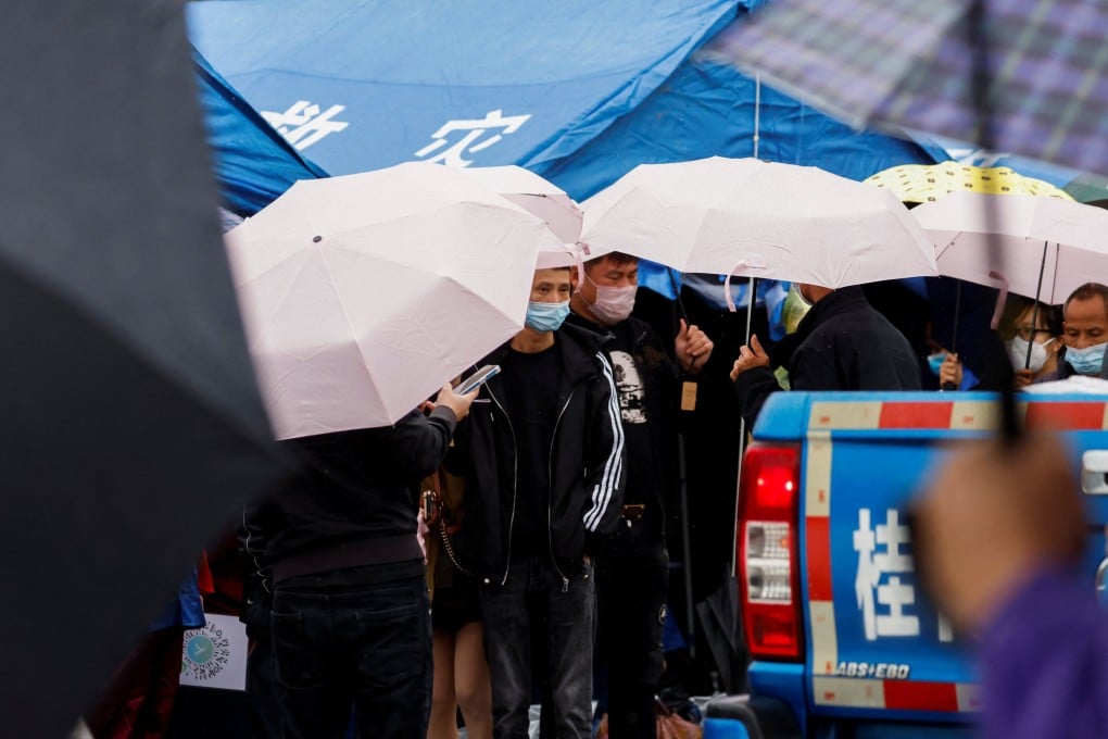 People gather at the entrance of Lu village near the site where a China Eastern Airlines Boeing 737-800 plane flying from Kunming to Guangzhou crashed, in Wuzhou, Guangxi Zhuang autonomous region on Monday. Photo: Xinhua