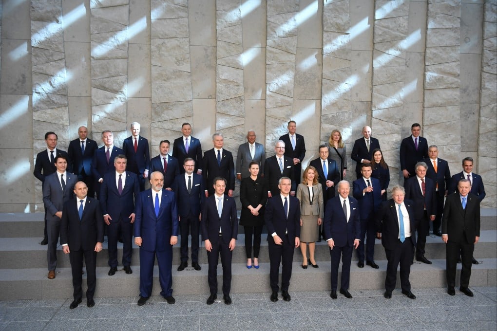 Nato heads of states stand together during an extraordinary summit in Brussels where they will address the consequences of Russia’s invasion of Ukraine. Photo: EFA