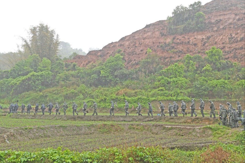 Rescuers on their way to search for the remaining black box in the area around the crash site in southern China’s Guangxi Zhuang autonomous region. The cockpit voice recorder has been recovered. Photo: Xinhua