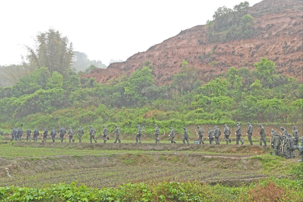 Rescuers on their way to search for the remaining black box in the area around the crash site in southern China’s Guangxi Zhuang autonomous region. The cockpit voice recorder has been recovered. Photo: Xinhua