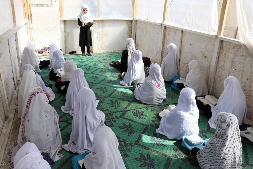 Afghan girls attend a lesson in a makeshift classroom at their primary school in Kandahar, Afghanistan, on Wednesday, in the brief window that the Taliban allowed it to open. Photo: EPA