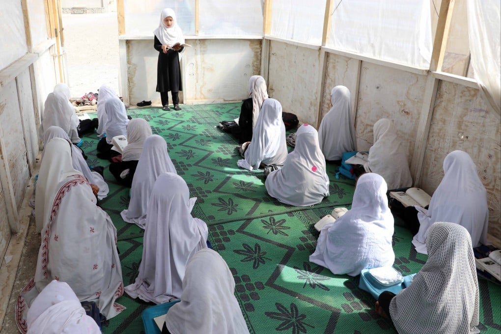 Afghan girls attend a lesson in a makeshift classroom at their primary school in Kandahar, Afghanistan, on Wednesday, in the brief window that the Taliban allowed it to open. Photo: EPA