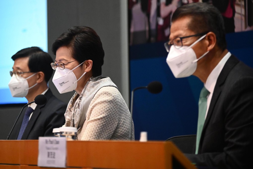 (From left) John Lee, Carrie Lam and Paul Chan hold a briefing on anti-pandemic policies earlier this week. Photo: Pool