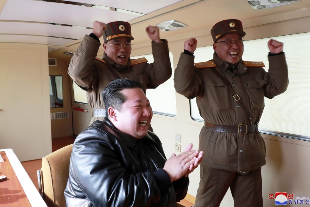 North Korean leader Kim Jong-un claps during a test-fire of the Hwasong-17 on Thursday. Photo: KCNA/KNS via AP