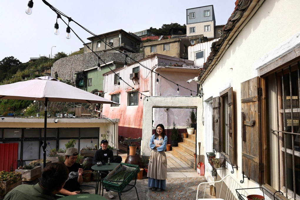 Dongyin native Tsai Pei-yuan chats with other co-founders of Salty Island Studio in Dongyin, Taiwan. Photo: Reuters