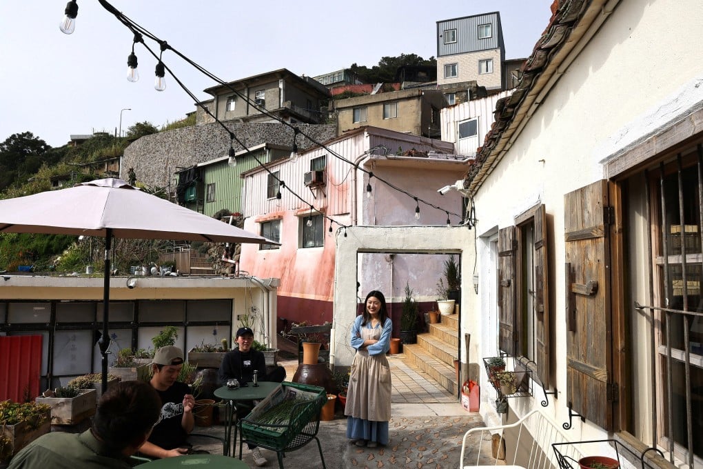 Dongyin native Tsai Pei-yuan chats with other co-founders of Salty Island Studio in Dongyin, Taiwan. Photo: Reuters