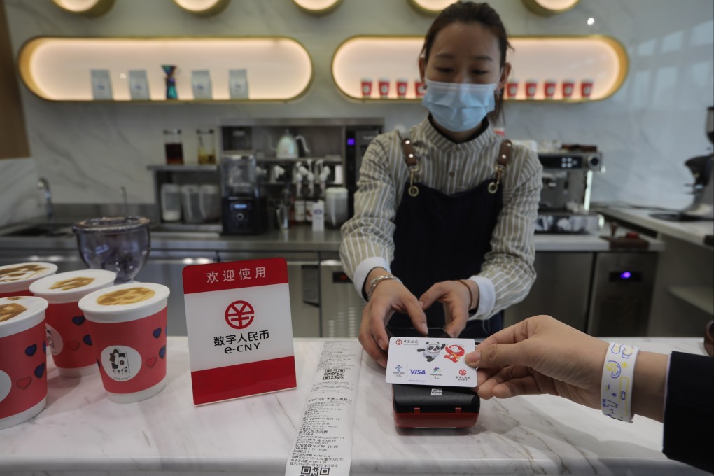 A staff member demonstrates how to buy coffee with e-CNY at a cafe at the National Fintech Demonstration Centre in Beijing last month. Photo: Simon Song
