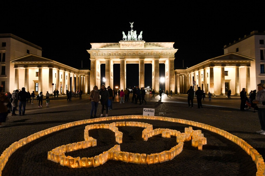A dove of peace in solidarity with the victims of Russia’s invasion in Ukraine is installed from LED lights in front of the Brandenburg Gate before the lights are switched off to mark the Earth Hour in Berlin, Germany on March 26. Photo: Reuters