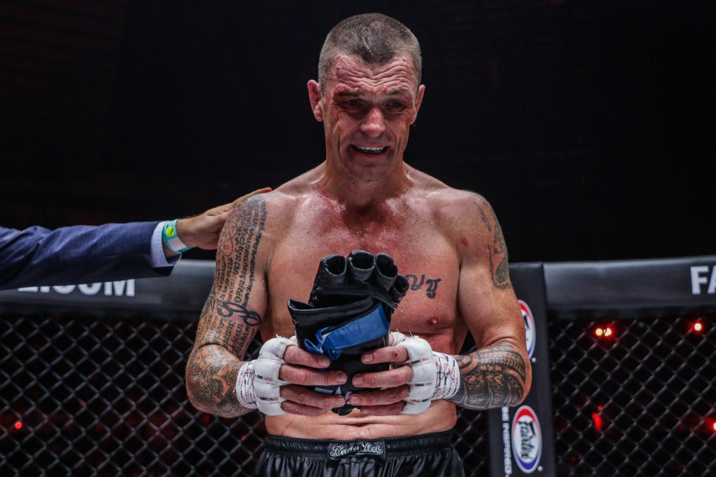 John Wayne Parr lays down his gloves in the ONE Circle, following the end of his career at ONE X in Singapore. Photos: Dux Carvajal/ONE Championship