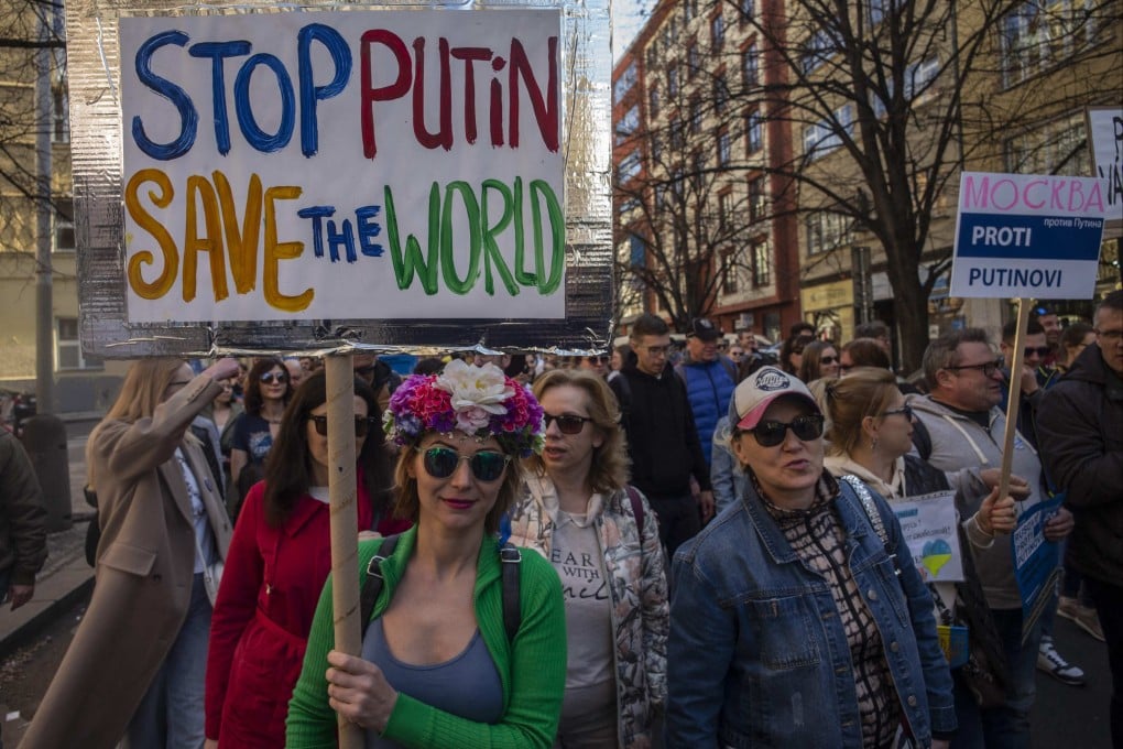 Members of Prague’s Russian community take part in an anti-war demonstration in Prague, Czech Republic on March 26. Photo: AFP