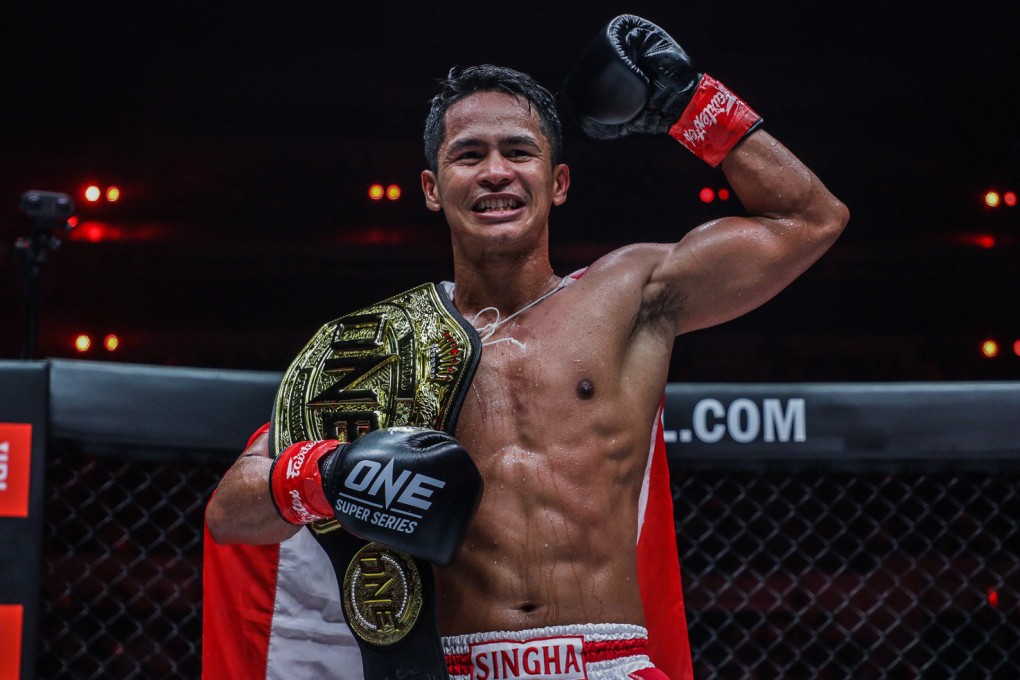 Superbon celebrates after beating Marat Grigorian to retain his featherweight kickboxing title at ONE X in Singapore. Photos: ONE Championship