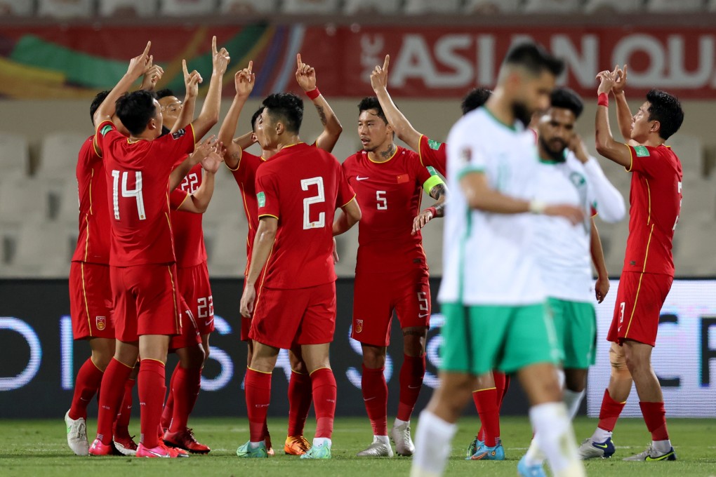 Chinese players point to the sky after scoring a penalty against Saudi Arabia as they pay tribute to the victims of the recent air crash back home in Guangxi. Photo: Xinhua