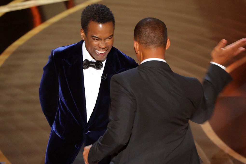 Will Smith hits Chris Rock at the Oscars ceremony on Sunday. It was a slap heard around the world, but not the first shocking moment at an Academy Awards presentation. Photo: Reuters
