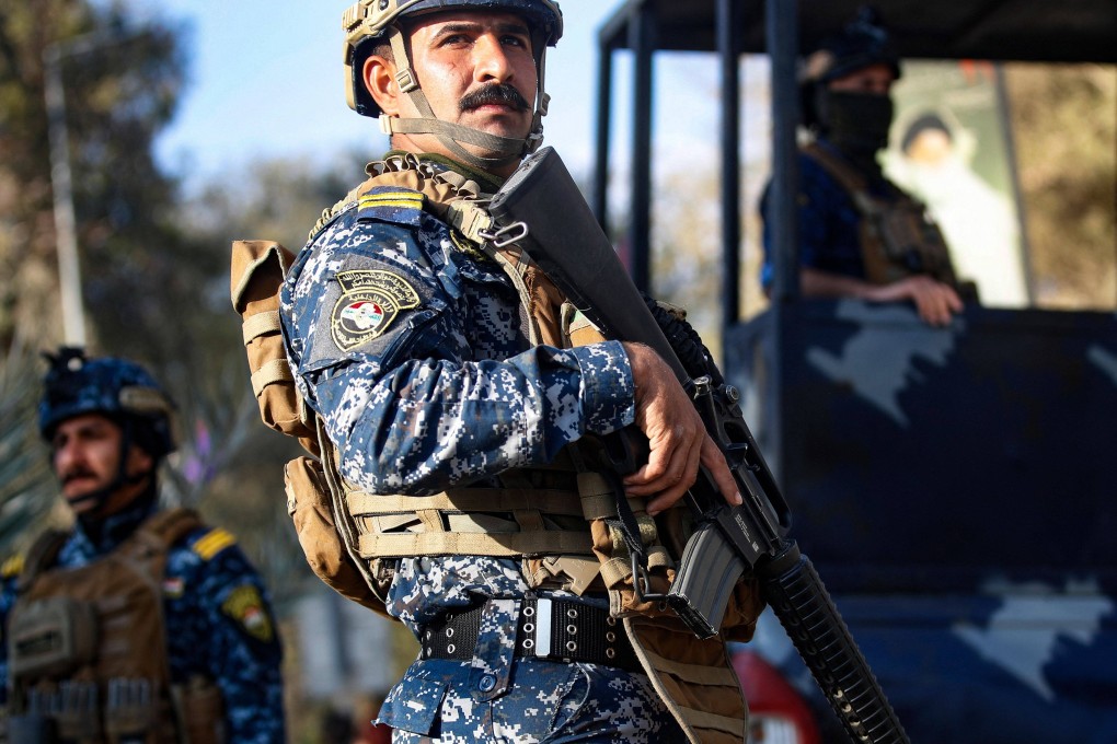 Members of the Iraqi security forces stand guard in the streets of the capital Baghdad, on March 25. Photo: AFP