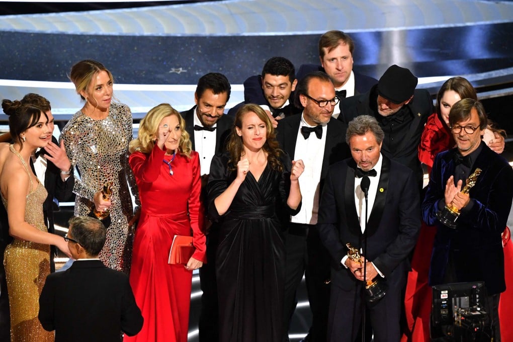 CODA cast and crew accept the award for best picture onstage at the 94th Oscars ceremony at the Dolby Theatre in Hollywood. The heartwarming indie drama about a deaf family defying the odds beat early runners The Power of the Dog and Belfast to the top prize. Photo: AFP