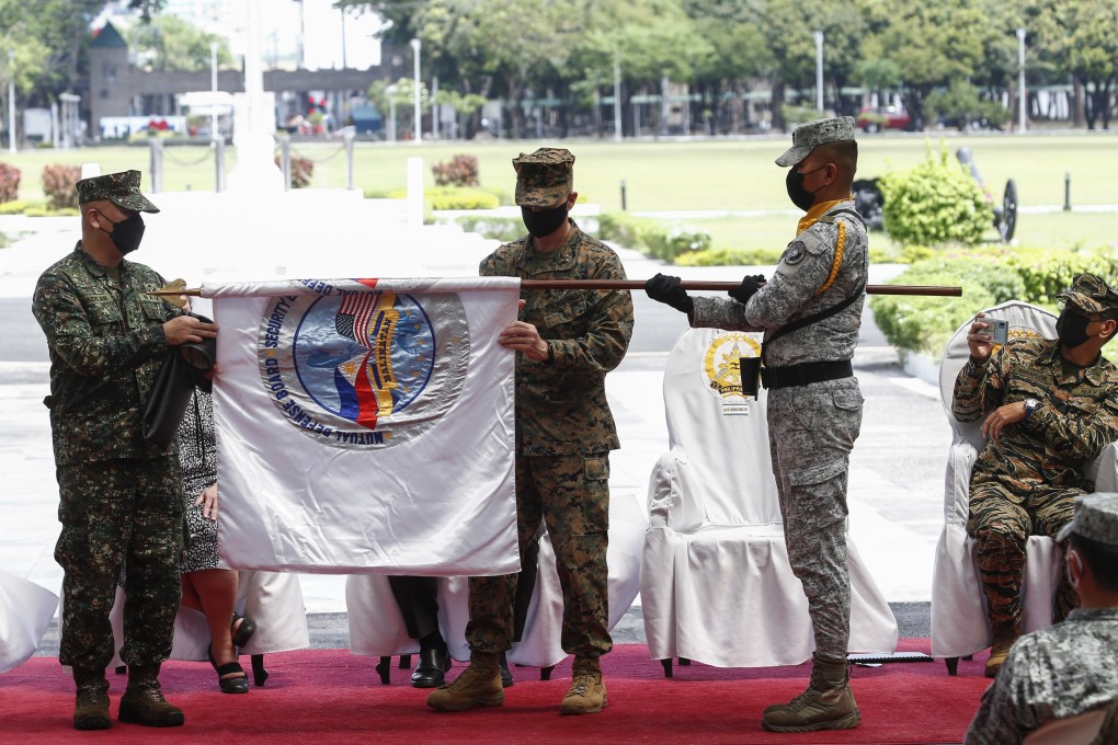 Philippine and US generals unfurl a flag during the opening ceremony of the joint military drills at Camp Aguinaldo in Quezon City, Philippines, on Monday. Photo: EPA-EFE