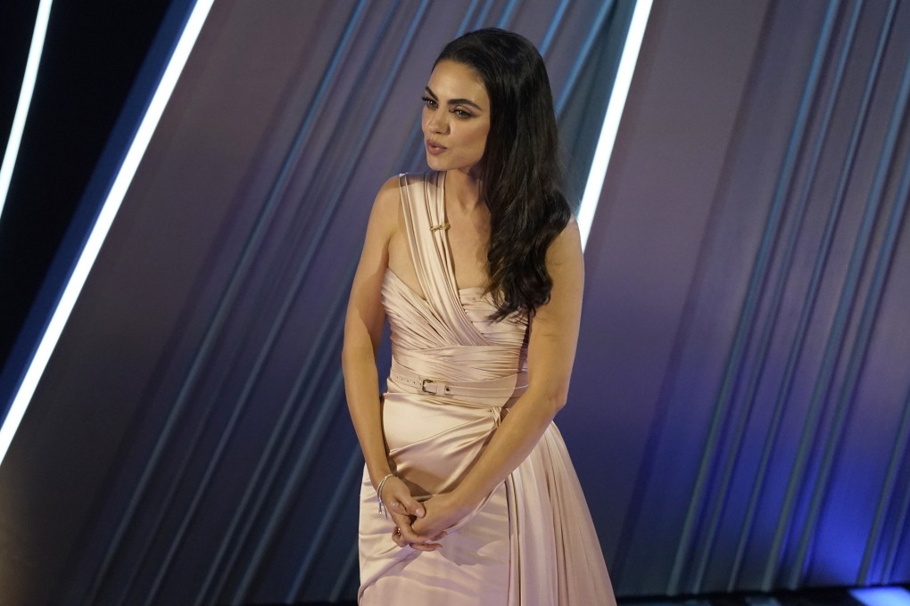 Mila Kunis introduces a performance by Reba McEntire at the Oscars on Sunday. The actress, who was born in Ukraine,  used the moment to speak up for its people following Russia’s military invasion of the country. Photo: AP