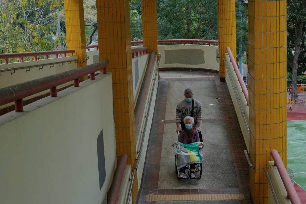An elderly couple wearing masks use a footbridge in Hong Kong on March 20. Stringent social distancing measures have upended daily routines. Photo: AP